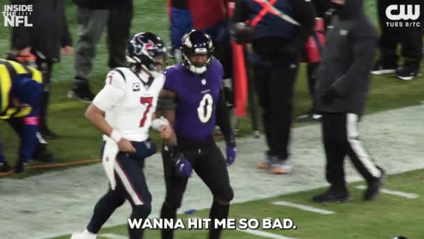 Roquan Smith and C.J. Stroud exchange words after a play